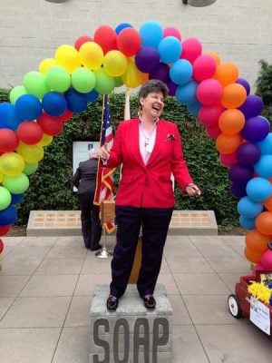 Attorney Stephanie Loftin stands on the replica of Harvey Milk's "soapbox," which he stood on when he spoke in public. In May, Loftin was inducted into the Memorial Wall at Harvey Milk Promenade Park for her work in fighting discrimination in the gay community. Photo: Michael Buitron.